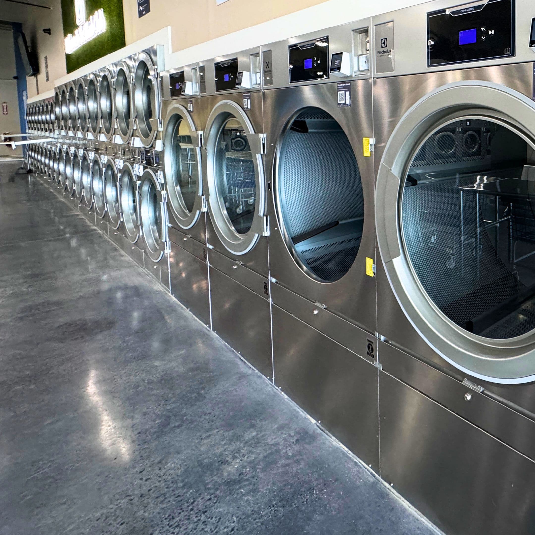 WashLuxe team handling and organizing business laundry for pickup and delivery